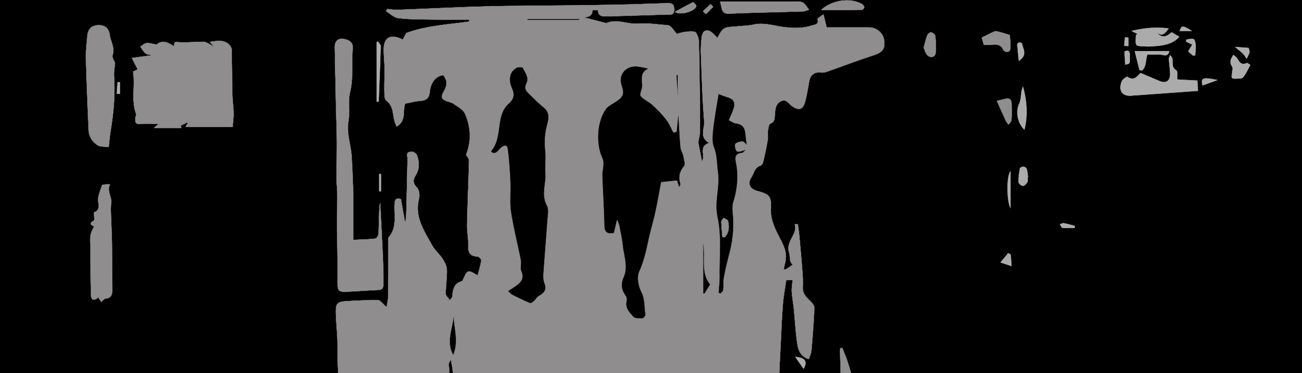 Black and gray image of abstract silhouettes of people standing in a hallway, backlit by an open door