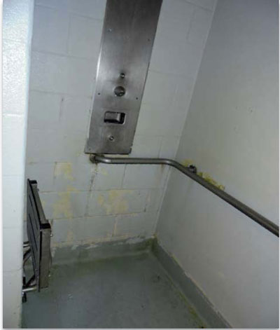 Photo of a dirty shower stall at Adelanto Detention Center