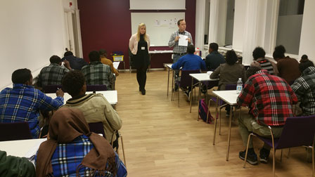 Photo of a briefing for asylum seekers ahead of registration at the Swedish Migration Agency. 